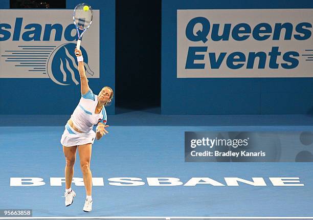 Kim Clijsters of Belgium serves in her Womens final match against Justine Henin of Belgium during day seven of the Brisbane International 2010 at...