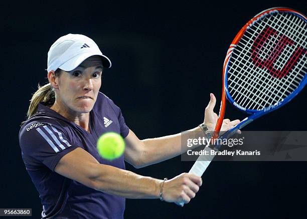 Justine Henin of Belgium plays a backhand in her Womens final match against Kim Clijsters of Belgium during day seven of the Brisbane International...