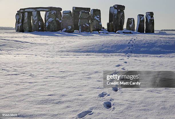 Footsteps in the snow lead from the historic monument of Stonehenge on January 9 2010, in Wiltshire, England. The UNESCO world heritage site and one...