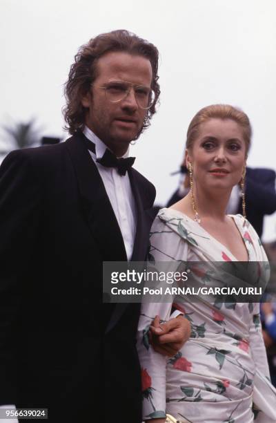 Christophe Lambert et Catherine Deneuve lors du Festival de Cannes en mai 1987, France.