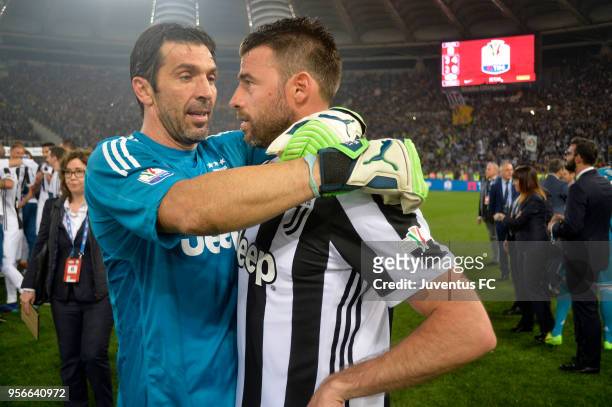 Juventus goalkeeper Gianluigi Buffon and his teammate Andrea Barzagli celebrate the victory after the TIM Cup Final between Juventus and AC Milan at...