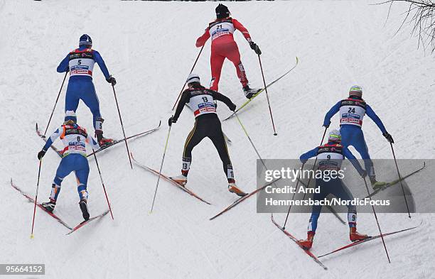 Sara Renner of Canada leads a group, behind her compete Alena Sidko of Russia, Katrin Zeller of Germany and Evgenia Medvedeva of Russia during the...