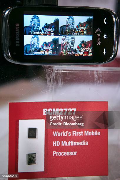 Samsung Electronics Co. Instinct HD phone, which is powered by Broadcom Corp.'s BCM2727 chipset, sits on display during the 2010 International...