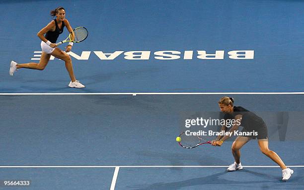 Melinda Czink of Hungary volleys playing with Arantxa Parra Santonja of Spain in her Womens double final match against Andrea Hlavackova of the Czech...