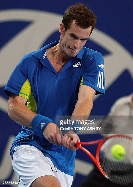 Andy Murray of Britain returns against Tommy Robredo of Spain during their men's singles final match of the Hopman Cup in Perth on January 9, 2010....