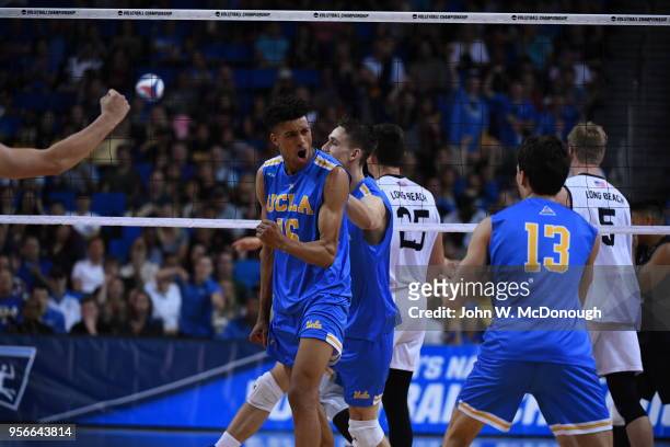 Daenan Gyimah of the UCLA Bruins reacts to a point scored against the Long Beach State 49ers during the Division 1 Men's Volleyball Championship on...