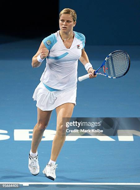 Kim Clijsters of Belgium celebrates winning the first set in the Women's final against Justine Henin of Belgium during day seven of the Brisbane...