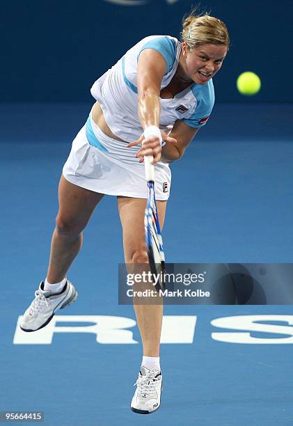 Kim Clijsters of Belgium serves in the Women's final against Justine Henin of Belgium during day seven of the Brisbane International 2010 at...