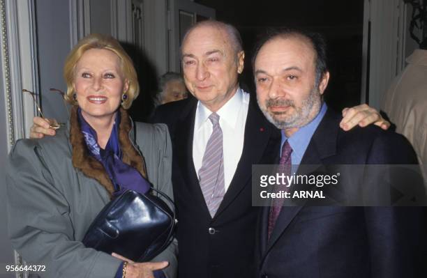Michèle Morgan, Gérard Oury et Claude Berry lors d'une soirée à Paris le 9 février 1988, France.