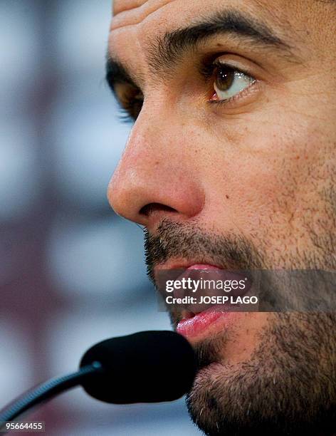 Barcelona's coach Pep Guardiola gestures during a press conference after a training session at Ciutat Esportiva Joan Gamper near Barcelona on January...