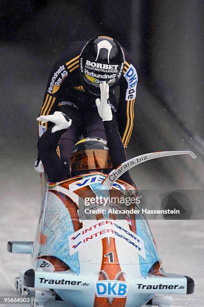 Team Germany 1 with pilot Sandra Kiriasis and Christin Senkel start at the first run of the two women's Bobsleigh World Cup event on January 9, 2010...