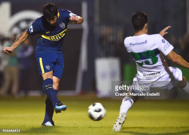 Pablo Perez of Boca Juniors kicks the ball and scores the opening goal during a match between Gimnasia y Esgrima La Plata and Boca Juniors as part of...