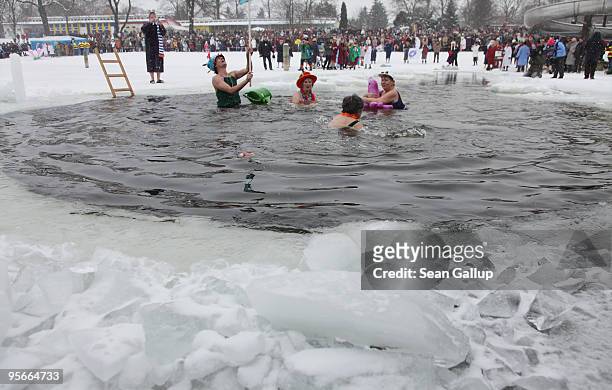 Participants swim in the frozen Orankesee lake at the 26th annual Berlin Seals winter swim on January 9, 2010 in Berlin, Germany. Approximately a...