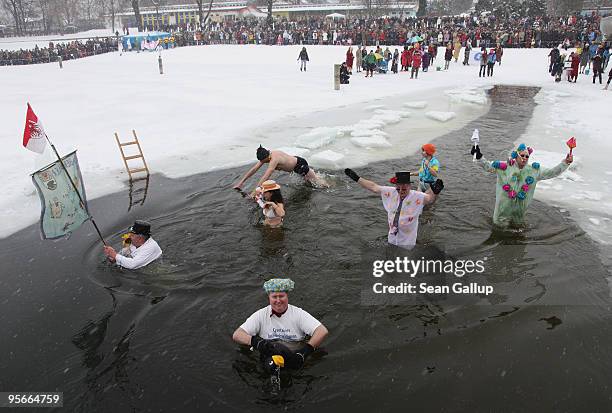 Participants swim in the frozen Orankesee lake at the 26th annual Berlin Seals winter swim on January 9, 2010 in Berlin, Germany. Approximately a...