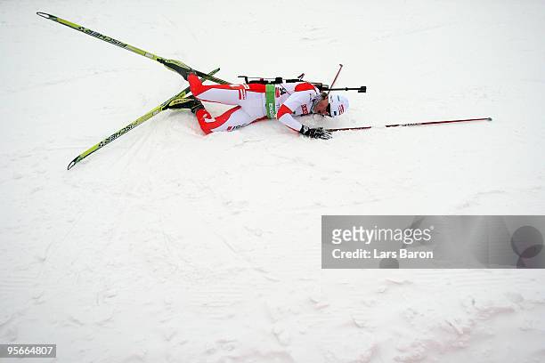Martten Kaldvee of Estland lies in the snow after the Men's 10km Sprint in the e.on Ruhrgas IBU Biathlon World Cup on January 9, 2010 in Oberhof,...