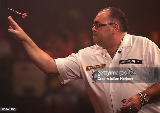 Tony O' Shea of England in action against Dave Chisnall of England during the Semi Final of The World Professional Darts Championship at Lakeside on...