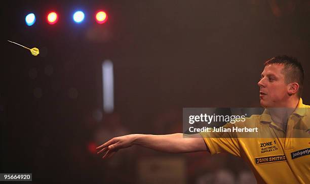 Dave Chisnall of England in action against Tony O' Shea of England during the Semi Final of The World Professional Darts Championship at Lakeside on...