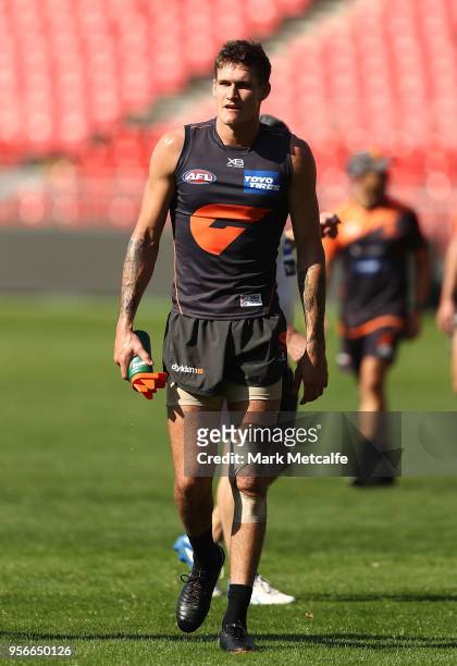 Rory Lobb of the Giants walks from the field of play after a heavy collission with Jake Stein of the Giants during a Greater Western Sydney Giants...