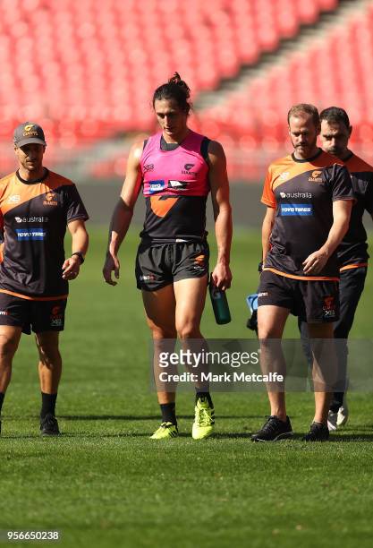 Jake Stein of the Giants walks from the field of play after a heavy collission with Rory Lobb of the Giants during a Greater Western Sydney Giants...