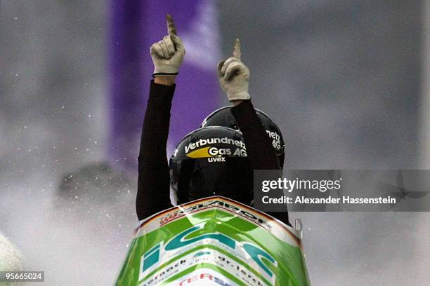 Pilot Cathleen Martini and Romy Logsch of Team Germany 2 celebrate winning after the final run of the two women's Bobsleigh World Cup event on...