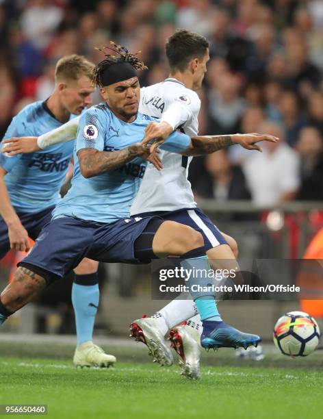 DeAndre Yedlin of Newcastle and Erik Lamela of Tottenham battle for the ball during the Premier League match between Tottenham Hotspur and Newcastle...