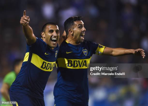 Ramon Abila of Boca Juniors celebrates with teammate Carlos Tevez after scoring the second goal of his team during a match between Gimnasia y Esgrima...