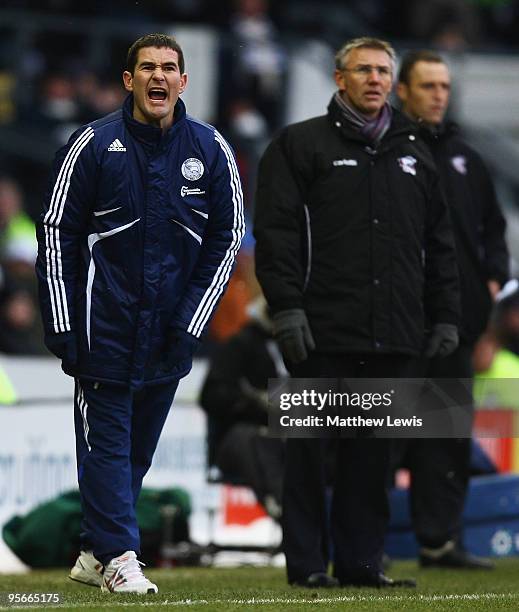 Nigel Clough, manager of Derby County reacts to a decision, as Nigel Atkins, manager of Scunthorpe United looks on during the Coca-Cola Championship...