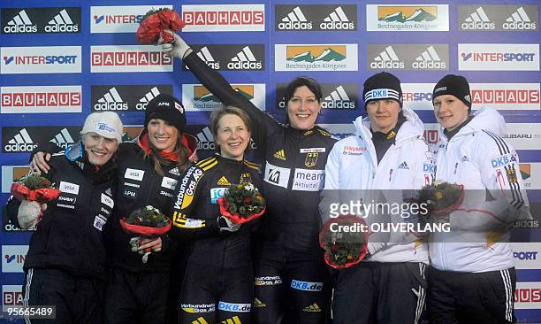 Canada's Kaillie Humphries and Heather Moyse, second, Germany's winners Cathleen Martini and Romy Logsch and Germany's Sandra Kiriasis und Christin...