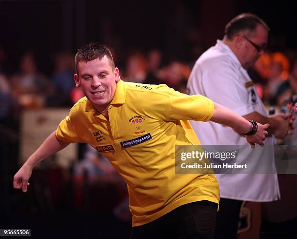 Dave Chisnall of England celebrates beating Tony O' Shea of England during the Semi Final of The World Professional Darts Championship at Lakeside on...