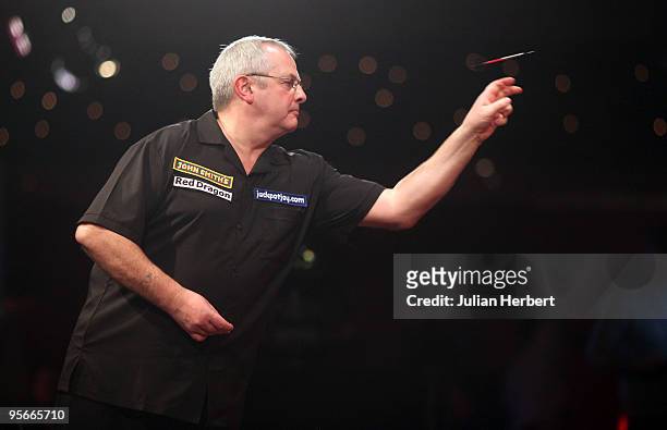 Martin Phillips of Wales in action against Martin Adams of England during the Semi Final of The World Professional Darts Championship at Lakeside on...