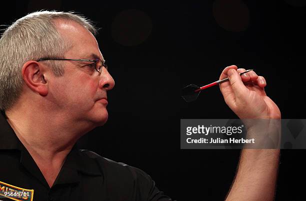 Martin Phillips of Wales in action against Martin Adams of England during the Semi Final of The World Professional Darts Championship at Lakeside on...