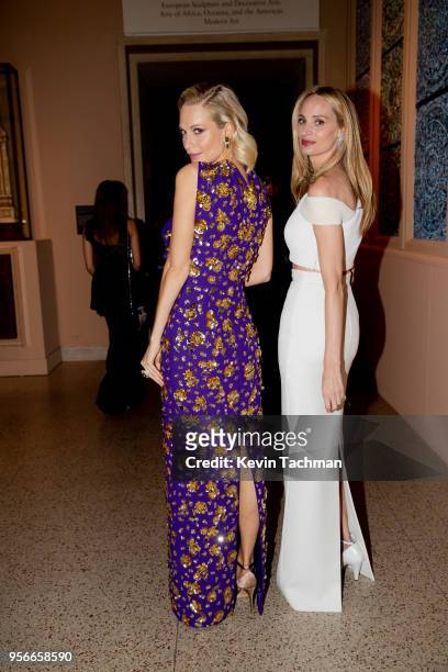 Poppy Delevingne and Lauren Santo Domingo attend the Heavenly Bodies: Fashion & The Catholic Imagination Costume Institute Gala at The Metropolitan...