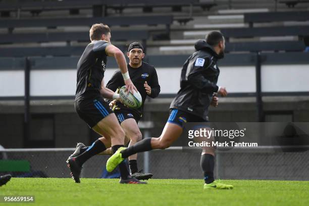 Beauden Barrett passes to Nehe Milner-Skudder during a Hurricanes Captains Run at Rugby League Park on May 10, 2018 in Wellington, New Zealand.