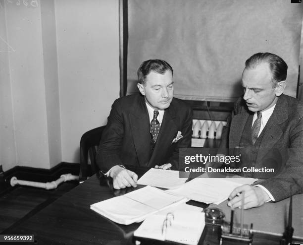 New legal light of SEC. Robert H. Jackson, now Special Counsel for Securities and Exchange Commission, left, photographed with James M. Landis,...