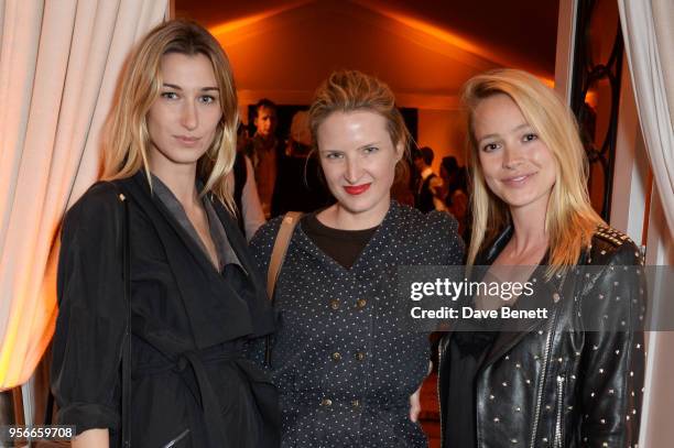 Lauren Remington-Platt, Fiona Scarry and guest attend Goga Ashkenazi's celebration of the 'Sustainable Surf' collaboration with Marc Quinn, with...