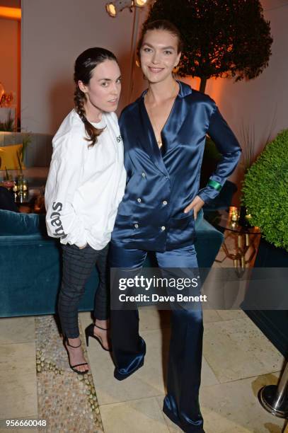 Tallulah Harlech and Arizona Muse attend Goga Ashkenazi's celebration of the 'Sustainable Surf' collaboration with Marc Quinn, with dinner at her...