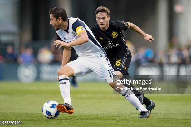 Columbus Crew midfielder Luis Argudo pursues Philadelphia Union midfielder Alejandro Bedoya in the MLS regular season game between the Columbus Crew...