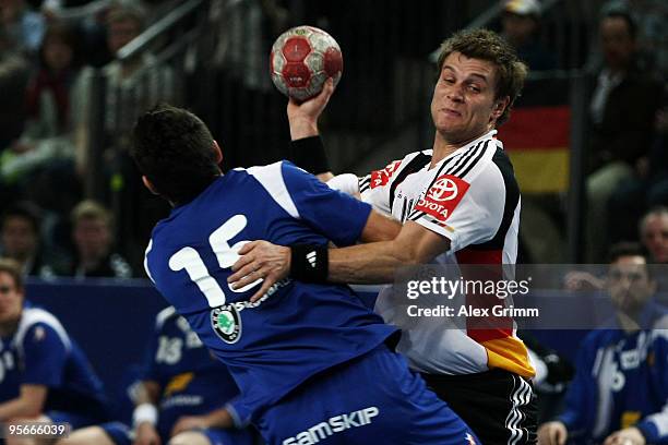 Michael Kraus of Germany is challenged by Alexander Petersson of Iceland during the international handball friendly match between Germany and Iceland...