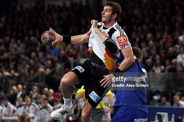 Michael Haass of Germany is challenged by Vignir Svavarsson of Iceland during the international handball friendly match between Germany and Iceland...