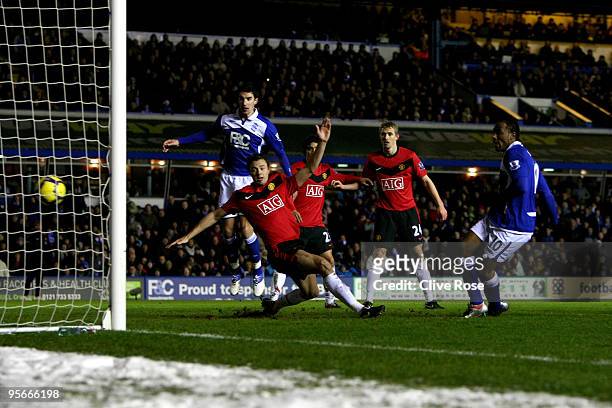 Cameron Jerome of Birmingham City shoots and scores during the Barclays Premier League match between Birmingham City and Manchester United at St....