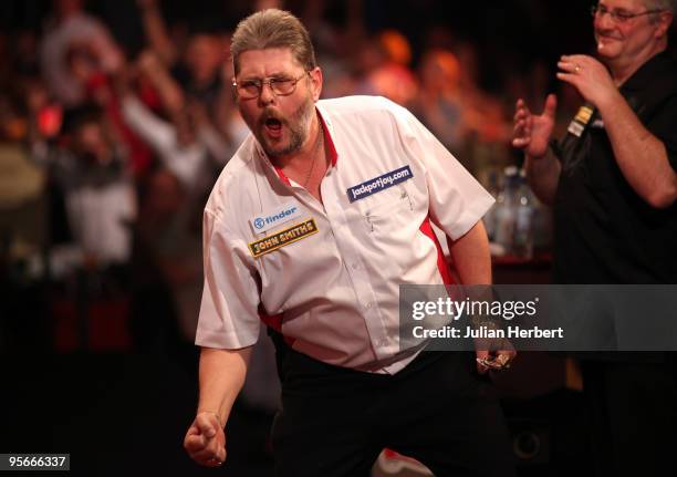 Martin Adams of England celebrates his victory against Martin Phillips of Wales after the Semi Final of The World Professional Darts Championship at...