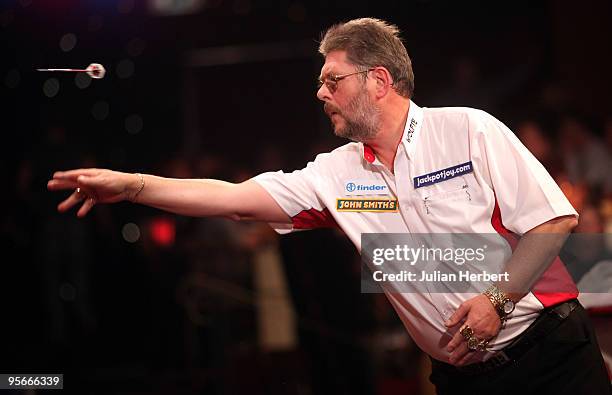 Martin Adams of England in action against Martin Phillips of Wales during the Semi Final of The World Professional Darts Championship at Lakeside on...