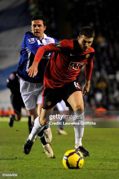 Barry Ferguson of Birmingham City and Michael Carrick of Manchester United battle for the ball during the Barclays Premier League match between...