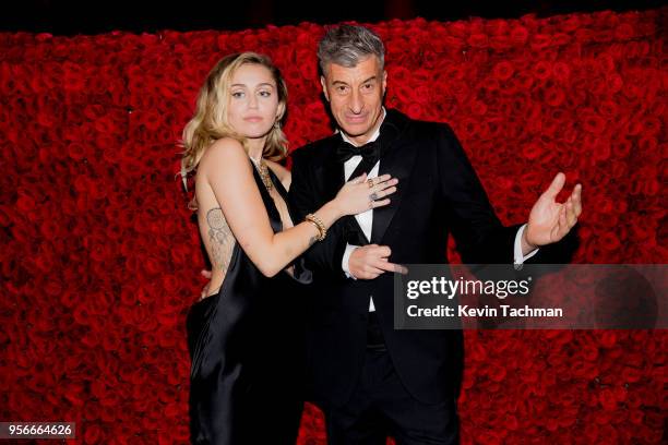 Miley Cyrus and Maurizio Cattelan attend the Heavenly Bodies: Fashion & The Catholic Imagination Costume Institute Gala at The Metropolitan Museum of...