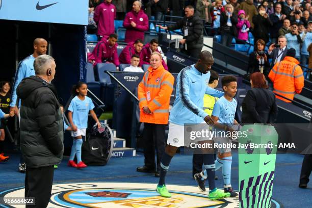 Yaya Toure of Manchester City walks out on to the pitch for his final Manchester City appearance during the Premier League match between Manchester...