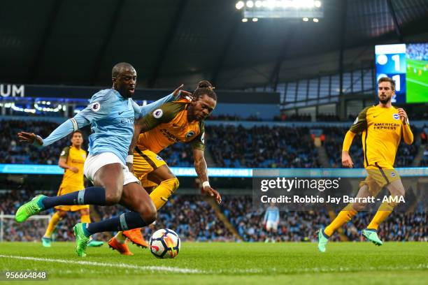 Yaya Toure of Manchester City and Gaetan Bong of Brighton & Hove Albion during the Premier League match between Manchester City and Brighton and Hove...