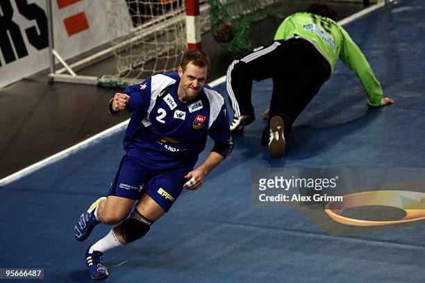 Vignir Svavarsson of Iceland celebrates a goal as goalkeeper Silvio Heinevetter of Germany reacts during the international handball friendly match...