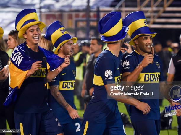 Leonardo Jara, Lisandro Magallán and Ramon Abila of Boca Juniors smile after winning the Superliga 2017/18 against Gimnasia y Esgrima La Plata at...
