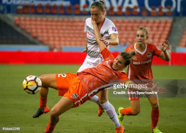 Houston Dash defender Amber Brooks leaps to trap the ball during the soccer match between the Portland Thorns and Houston Dash on May 9, 2018 at BBVA...