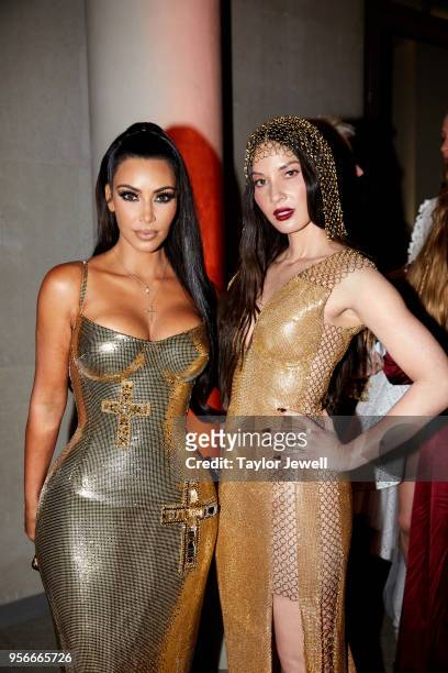 Kim Kardashian West and Olivia Munn attend Heavenly Bodies: Fashion & The Catholic Imagination Costume Institute Gala at The Metropolitan Museum of...